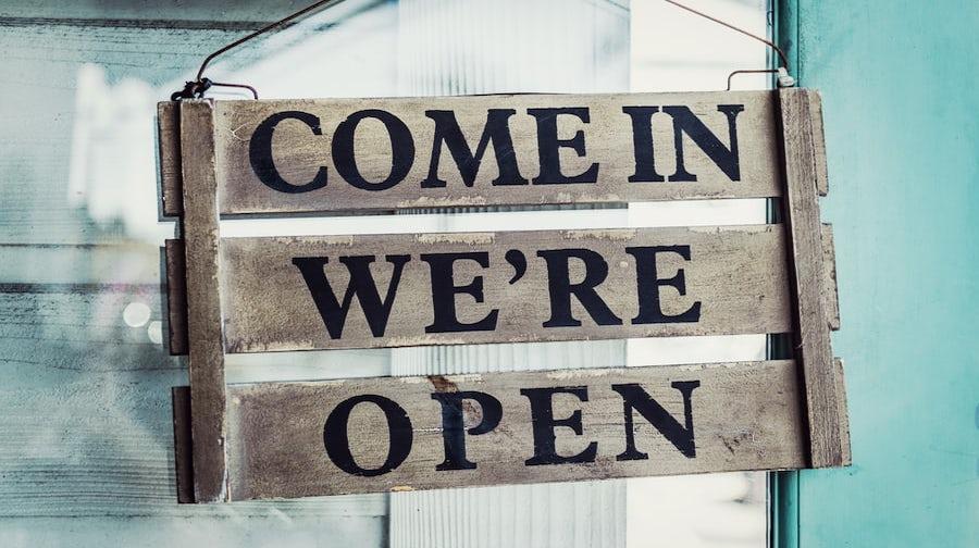 sign saying "come in we're open"