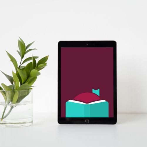 A tablet is next to a plant in a cup of water. The tablet has the Libby logo filling the screen. 